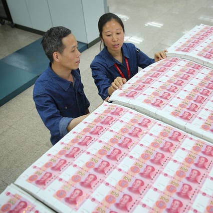 China’s new bank lending hit a record 19.95 trillion yuan (US$3.1 trillion) for the year, up 1.6 per cent from 19.63 trillion yuan in 2020. Photo: AFP