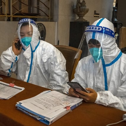 A woman checks into a hotel for quarantine in Wuhan on December 23, 2021. A US Senate bill would sanction Chinese officials who prevent an investigation into the lab-leak theory about Covid-19’s origins.  Photo: Bloomberg