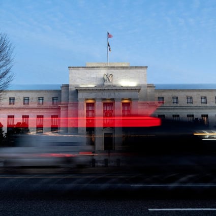 Vehicles drive past the US Federal Reserve in Washington, DC, on January 10. Even the rise of the Omicron variant hasn’t been able to derail the prospect of tighter monetary policy. Photo: AFP