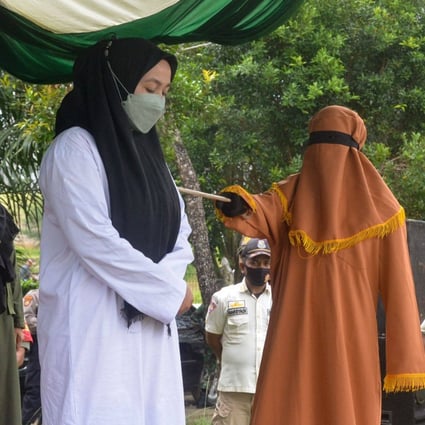 A woman is flogged 100 times for adultery in Idi, East Aceh. Photo: AFP