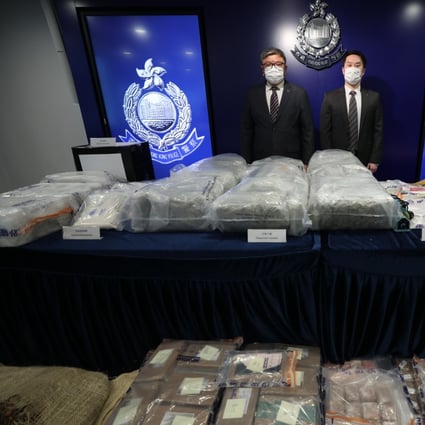 Superintendent Chan Kong-ming (left) and Senior Inspector Ng Ka-lun of the narcotics bureau with the drugs seized during the raids on Tuesday and Wednesday. Photo: Xiaomei Chen