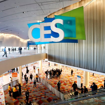 Attendees pass by a CES sign during CES 2022 in Las Vegas, January 6, 2022. Photo: Reuters