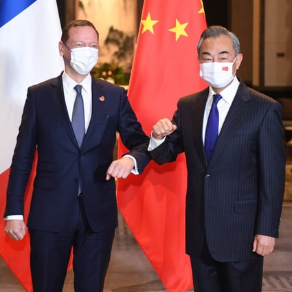 Chinese State Councillor and Foreign Minister Wang Yi, right,  co-chairs the 22nd China-France Strategic Dialogue with Emmanuel Bonne, diplomatic counsellor to French President Emmanuel Macron, in Wuxi on January 13, 2022. Photo: Xinhua