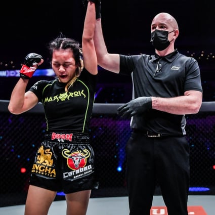 Supergirl’s arm is raised after winning a controversial split decision against Ekaterina Vandaryeva (right) at ONE: Heavy Hitters. Photos: David Ash/ONE Championship