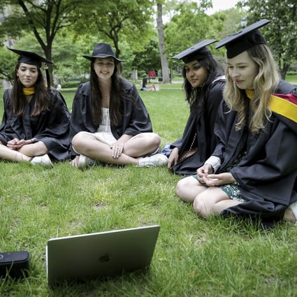 University of Pennsylvania students watch a graduation ceremony at their campus in Philadelphia. Photo: The Philadelphia Inquirer via AP