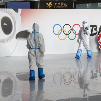 Officials wear protective gear at Beijing Capital International Airport amid Covid-19 fears as the city prepares to host the Winter Olympics. Photo: Kyodo