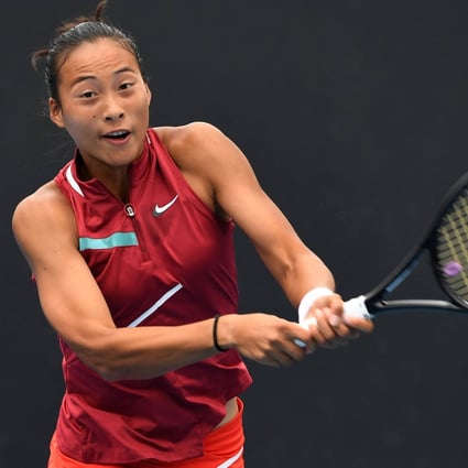 China’s Zheng Qinwen hits a return against Belarus’ Aliaksandra Sasnovich during day one of the Australian Open. Photo: AFP