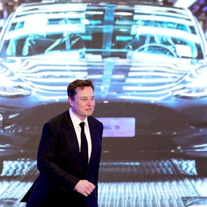 Tesla CEO Elon Musk walks next to a screen showing an image of Tesla Model 3 car. A new study found that Tesla Autopilot and other driver assisted systems underperform. Photo: Reuters