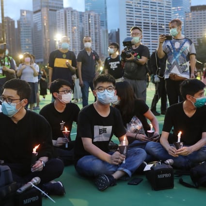 Opposition activist Joshua Wong (centre) at the banned Tiananmen Square vigil in 2020. Photo: Sam Tsang