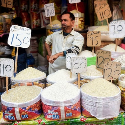 A shopkeeper waits for customers at a market in Karachi, Pakistan. Photo: AFP