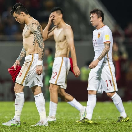 Chinese soccer players with tattoos, such as Zhang Linpeng (above left) and Wang Yongpo (above right), have been told to cover them up and banned from getting new tattoos. Negative views of tattoos have a long history in China. Photo: EPA