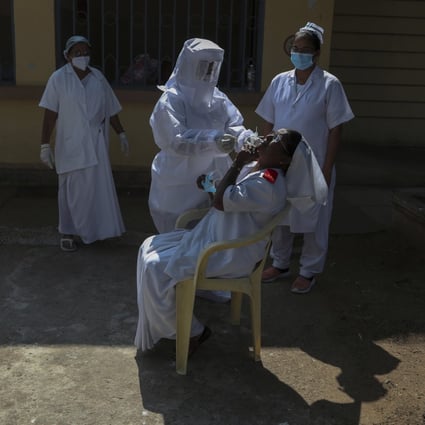 Health workers at a government hospital in Hyderabad, India. Photo: AP 