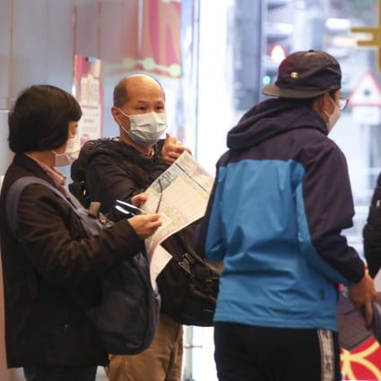 Buyers queueing for The Harmonie residential property project in Cheung Sha Wan at Henderson Land Development’s sales office at the Mira Place One in Tsim Sha Tsui on 22 January 2022. Photo: Xiaomei Chen
