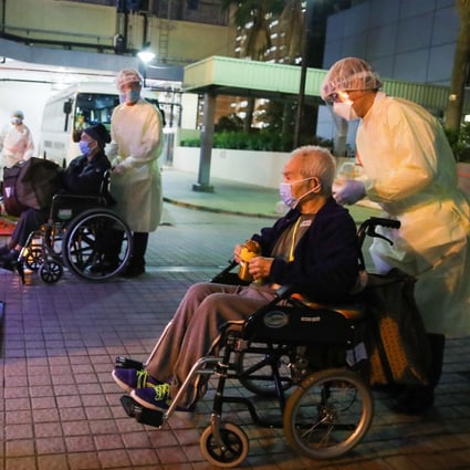 Elderly residents are moved out of a nursing home at Kwai Chung Estate on Saturday. Photo Edmond So 