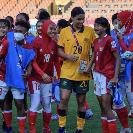 Australian football player Sam Kerr (centre) with Indonesian team players after an AFC Women’s Asian Cup group game and 2023 World Cup qualifier in India. Photo: Instagram / CommBank Matildas   
