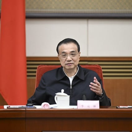 Chinese Premier Li Keqiang, a member of the Standing Committee of the Political Bureau of the Communist Party of China (CPC) Central Committee, talks with representatives from the education, science and technology, culture, health, and sports sectors at a symposium to hear their opinions on a draft government work report on January 21, 2022. Photo: Xinhua