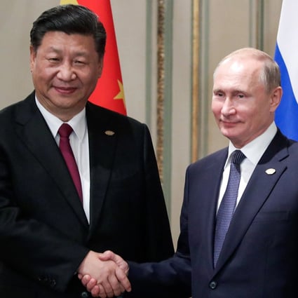 During a phone call last month, Russian President Vladimir Putin, right, told China’s President Xi Jinping, left, he would attend the Beijing Winter Olympics Games opening ceremony on February 4. But China says a report suggesting Xi asked Putin to refrain from invading Ukraine during the Games attempts to undermine the Olympics. Photo: Tass