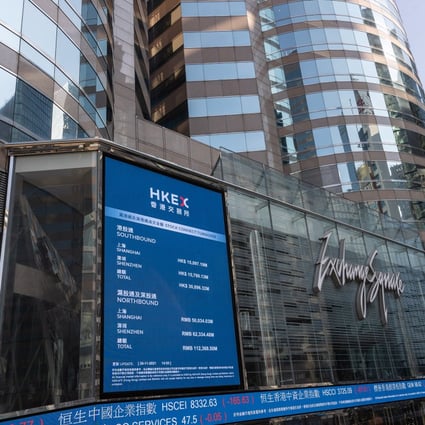 Electronic billboards display stock transactions on Exchange Square, the building housing the Hong Kong stock exchange. Photo: EPA-EFE