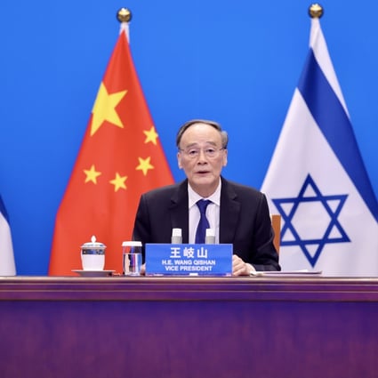 Chinese Vice-President Wang Qishan co-chairs a virtual meeting of the China-Israel Joint Committee on Innovation Cooperation with Yair Lapid, Israel’s foreign minister, via video link on Monday. Photo: Xinhua