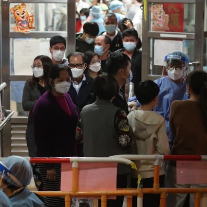 Residents of Cheung Bor House at the Choi Wan Estate in Wong Tai Sin undergo mandatory tests as part of a government lockdown on January 26. One security guard and two residents tested positive for Covid-19. Photo: Edmond So