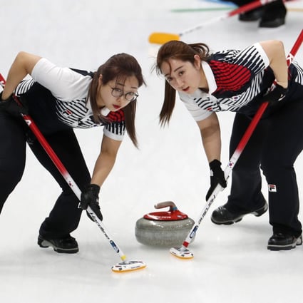Second Kim Seonyeong and lead Kim Yeongmi of South Korea sweep during their match against Japan at the Pyeongchang 2018 Winter Games. Photo: Reuters/Cathal McNaughton