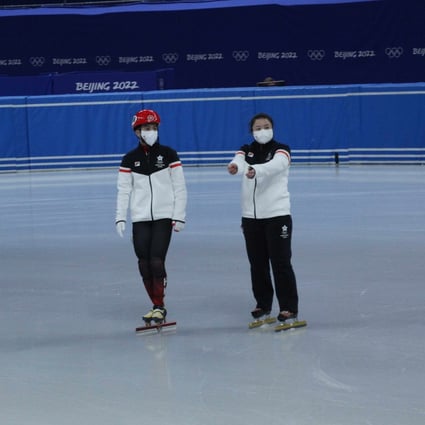 Hong Kong speed skater Sidney Chu and coach Sun Dandan seen here during a practice session in Beijing wearing tracksuits supplied by Fila. Photo: FILA