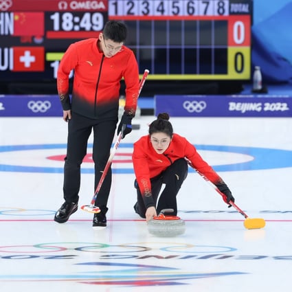 China’s Fan Suyuan (right) and Ling Zhi compete during the curling mixed doubles round robin session of the Winter Olympics. Photo: Xinhua