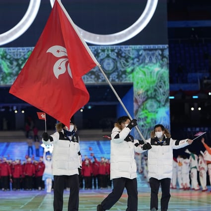 Sidney Chu, of Hong Kong, carries the city’s flag into the National Stadium during the opening ceremony of the 2022 Winter Olympics in Beijing. Photo: AP/Jae C Hong