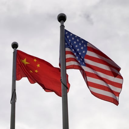 Chinese and American flags above a building in Shanghai, November 16, 2021. Photo: Reuters