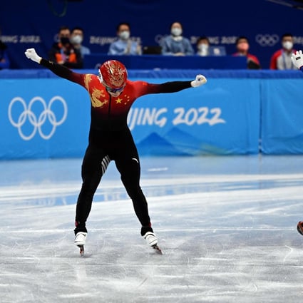 China’s Wu Dajing celebrates after helping his team win gold in the short track speedskating mixed relay event in Beijing. Photo: AFP
