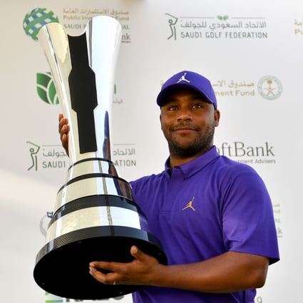 Harold Varner III of the US holds the winner’s trophy after the final round of the PIF Saudi International. Photos: Paul Lakatos/Asian Tour