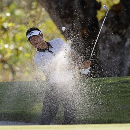 Carl Yuan chips out of the bunker on 12 at The Panama Championship. Photo: Getty Images