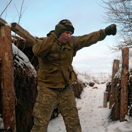 A member of the Ukrainian armed forces Bohdan practices kickboxing at combat positions near the line of separation from Russian-backed rebels in Luhansk Region, Ukraine on February 6. Photo: Reuters