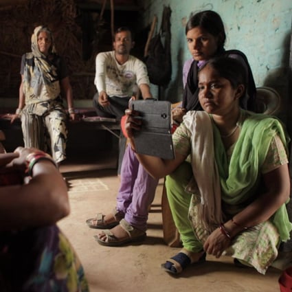 Meera (first from right) and Suneeta (second from right) in a still from Writing with Fire.