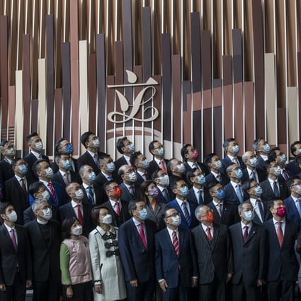 Hong Kong’s incoming lawmakers pose for photographs following an oath-taking ceremony at the Legislative Council in Hong Kong, on January 3. Photo: Bloomberg