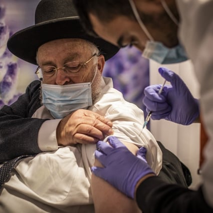 A man receives a dose of the Pfizer-BioNTech Covid-19 vaccine at a vaccination centre in Jerusalem on January 11, 2021, as a part of a nationwide campaign. By mid-January half a million Israelis had received their fourth dose of vaccination against the coronavirus. Photo: DPA