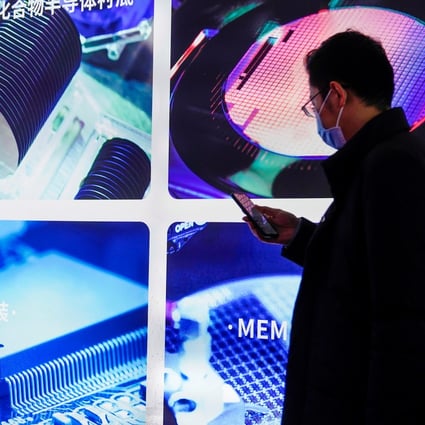 A man visits a display of semiconductor devices at Semicon China, a trade fair for semiconductor technology, in Shanghai on March 17, 2021. Photo: Reuters