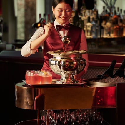 Punch is one of the oldest cocktails, dating back to the 17th century. A waitress serves punch at the Republic bar in the Ritz-Carlton Millenia Singapore. Photo: Ritz-Carlton Millenia Singapore