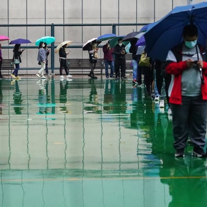 Local residents queue up for Covid-19 testing at a mobile specimen collection station. Photo: Felix Wong