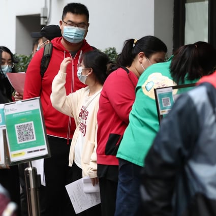 People queue up to receive the Sinovac vaccine at Kwun Chung Sports Centre on 27January 2022. Photo: Jonathan Wong