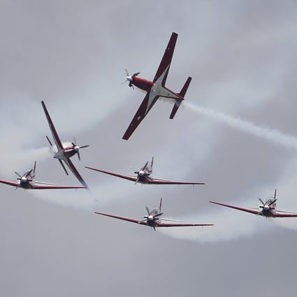 The Indonesian Air Force’s Jupiter Aerobatic Team takes part in an aerial display during the Singapore Airshow on February 15. Photo: AP