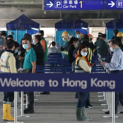 People queue at compulsory Covid-19  testing centres at Terminal 1, Hong Kong International Airport, Chek Lap Kok. SCMP writer Stephen McCarty recently encountered Hong Kong red tape at it’s worst at the airport. Photo: Felix Wong