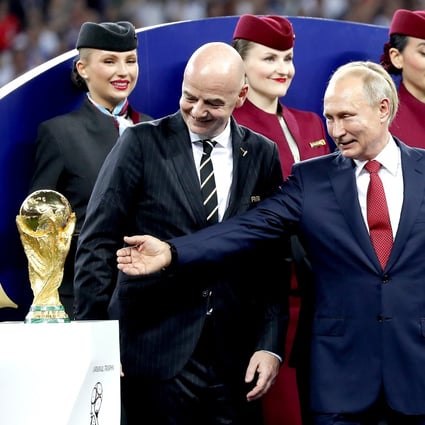 Russian President Vladimir Putin (right) and Fifa president Gianni Infantino next to the World Cup trophy after the 2018 final between France and Croatia in Moscow. Photo: EPA-EFE