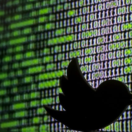 3D printed Twitter logo is seen in front of a displayed cyber code in this illustration taken March 2016. Photo: Reuters 