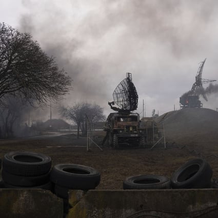 Smoke rises from an air defence base in the aftermath of an apparent Russian strike in Mariupol, Ukraine. Photo: AP