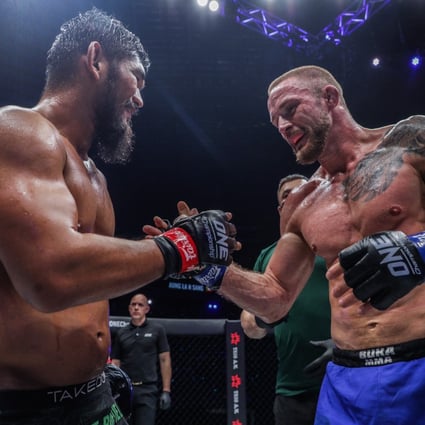 Aung La N Sang (left) and Vitaly Bigdash share a moment of respect after a three-round fight at ONE: Full Circle in Singapore. Photos: ONE Championship. 
