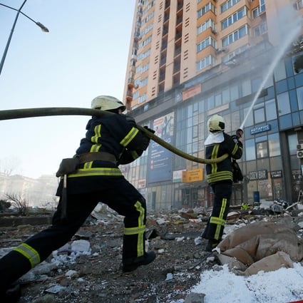 Firefighters tackle a blaze in a residential building damaged by shelling in Kyiv, Ukraine, on Saturday. Photo: Reuters