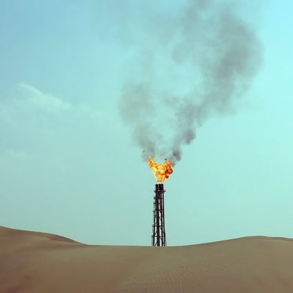 A flare from a gas well is seen in Qatar. Photo: AFP