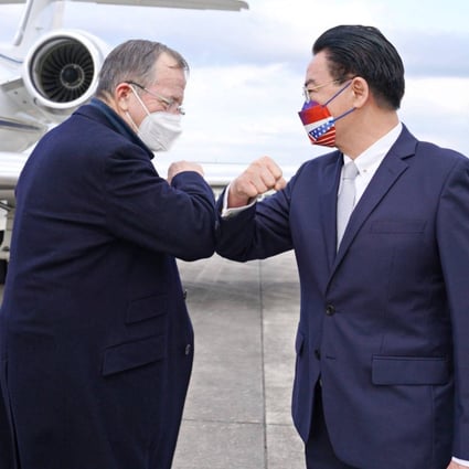 Michael Mullen, left, former US chairman of the Joint Chiefs of Staff, is greeted by Taiwan’s Foreign Minister Joseph Wu at Song Shan Airport in Taipei on Tuesday. Photo: AFP Photo / Ministry of Foreign Affairs