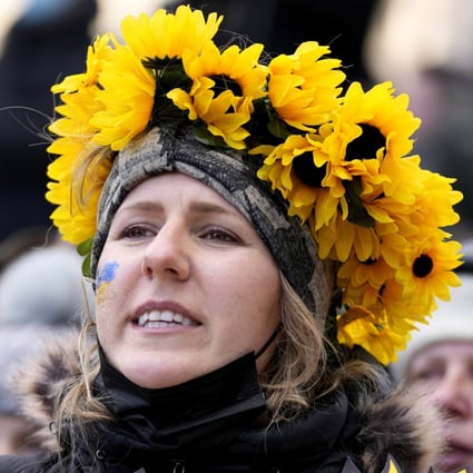 A protester wearing a crown of sunflowers rallies against Russia’s invasion of Ukraine in Ottawa, Canada on Sunday. Photo: The Canadian Press via AP